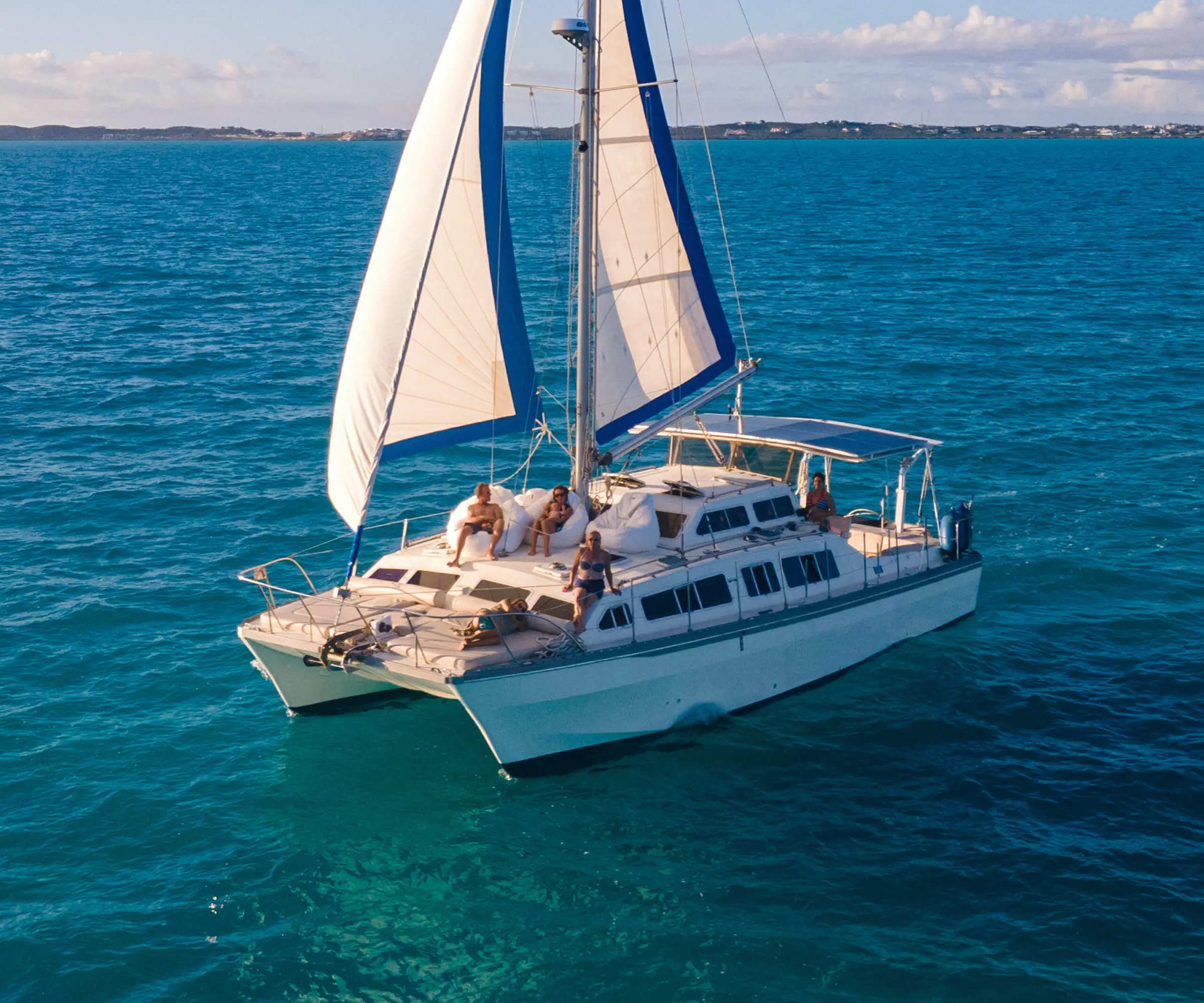 Metta, a 41 ft sailing catamaran, under sail in deep blue water
