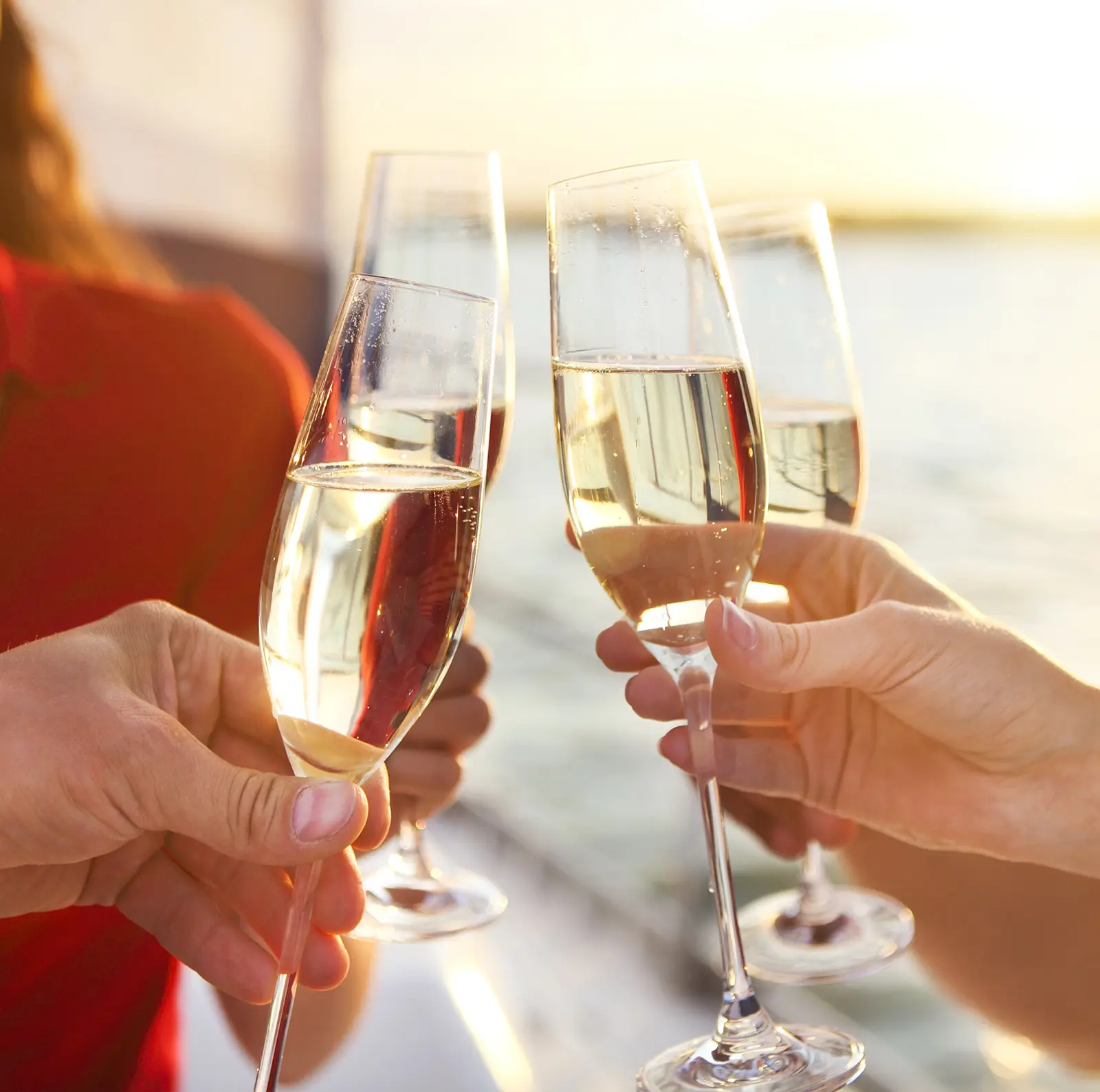 Two glasses of champagne raised on board
