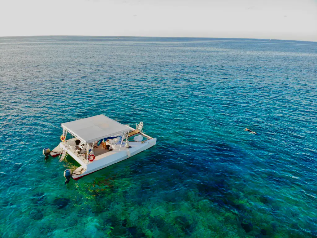 Slat Cat anchored over a reef