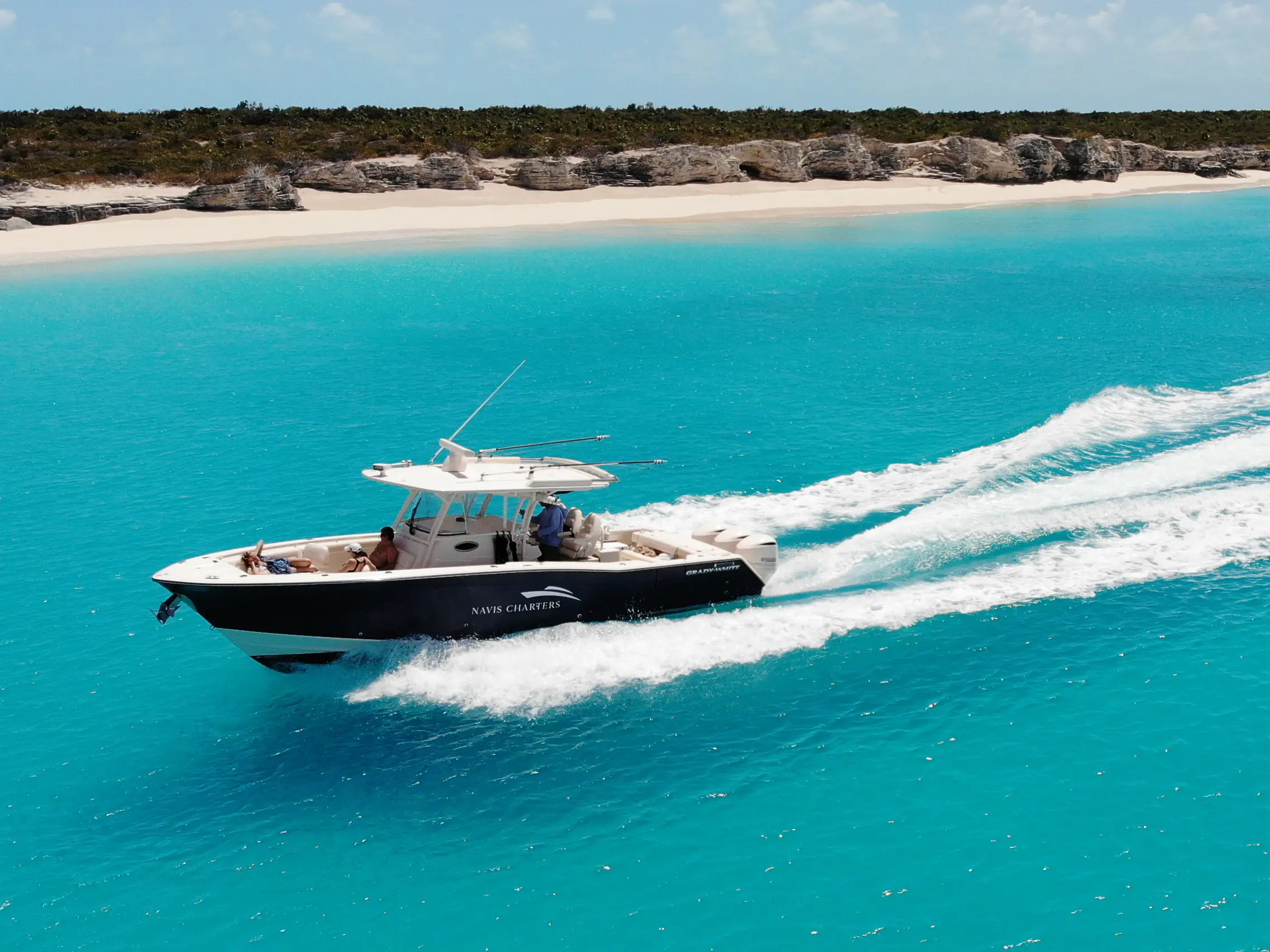 Sweet T running fast across turquoise water off the Caicos Cays